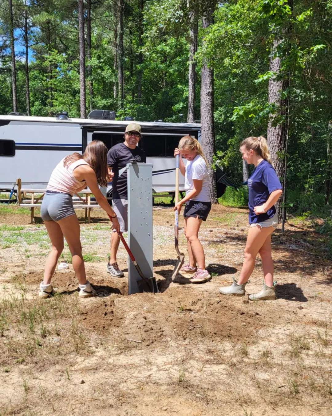 The work-camper team installing a power pedestal at Outside Inn Campground, Santee SC